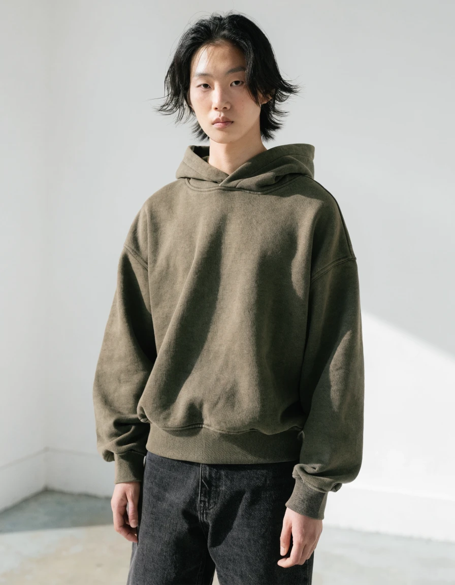 Relaxed-Fit Hoodie in olive, front.