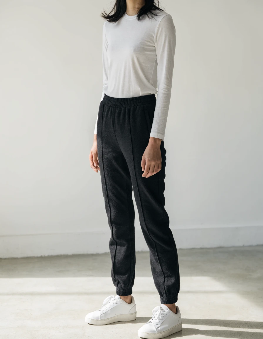 Track Pants in black, front.
